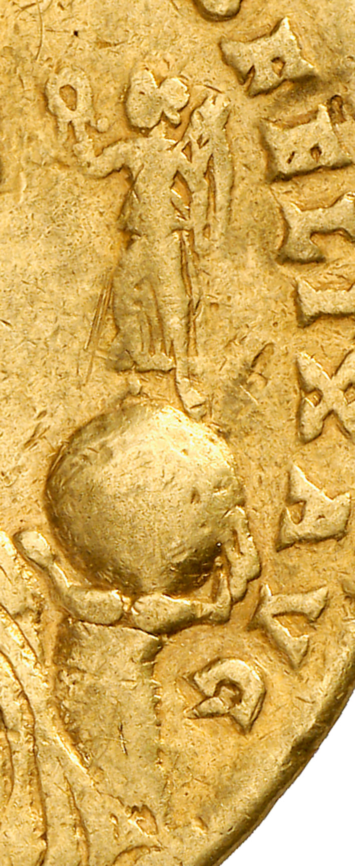 Left hand holds a globe depicting Victoria